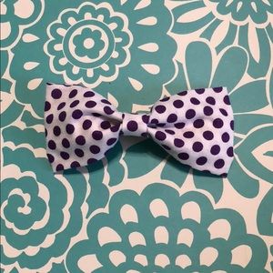 White and purple polka dot bow